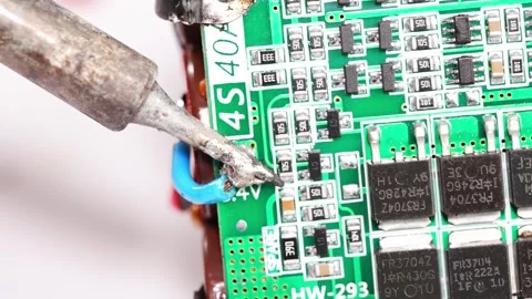 Repairing electronics with soldering in a workshop setup Stock Footage 333246845