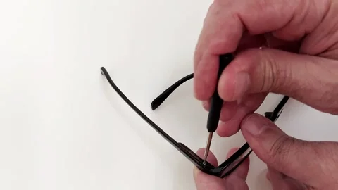 Repairing Eyeglass Hinge Screw Using Mini Screwdriver Tool Vídeo Stock 317744921