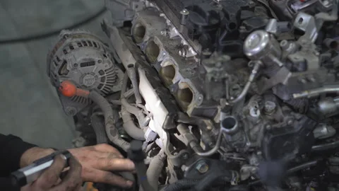 Repairing an internal combustion engine in a car service center Stock Footage 263922694
