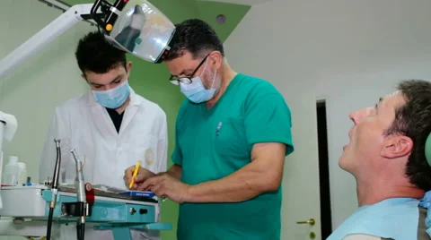 Repairing Patient's Teeth Stock Footage 54380922