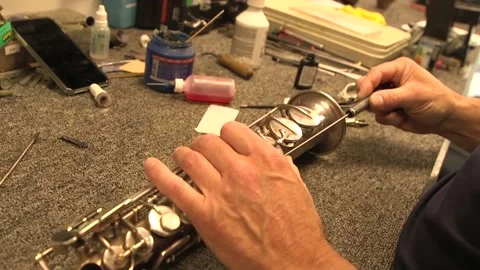 Repairing a saxophone Stock Footage 146166462