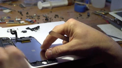 Repairing smartphone Stock Footage 83558527