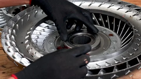 Repairing torque converter and installing needle thrust bearing. Stock Footage 344392418