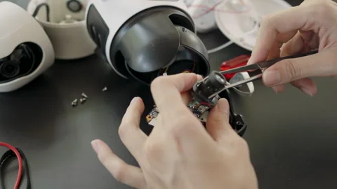 Repairing wireless CCTV camera close-up Stock Footage 333686409