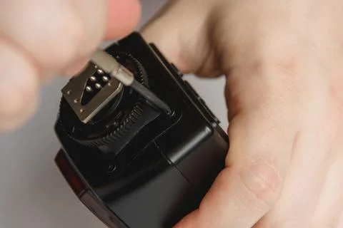 Repairman disassembling flash with screwdriver. Technician fixing broken Stock Photos