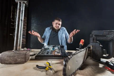 Repairman fixing problem with computer hardware 스톡 사진
