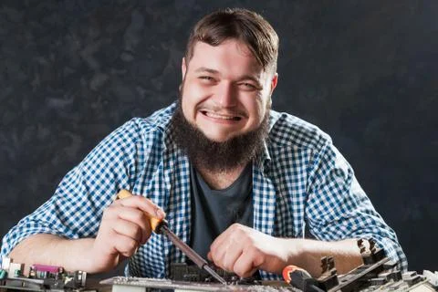 Repairman fixing problem with soldering tool Stock Photos
