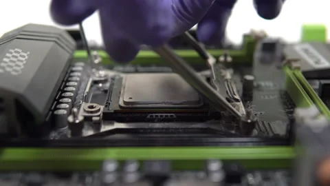 The repairman pulls the main processor out of the socket. Maintenance and Stock Footage 151902472