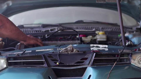 Repairman Repairs Engine of a Broken Car at Auto Repair Shop 4 Stock Footage 161190575