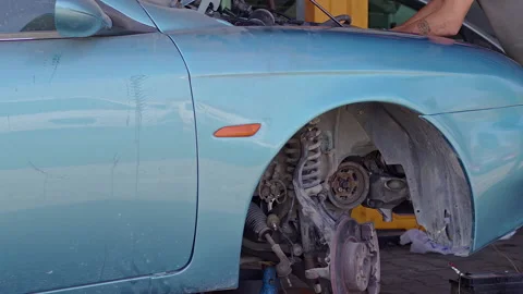 Repairman Repairs Engine of a Broken Car at Auto Repair Shop 3 Stock Footage 161193996