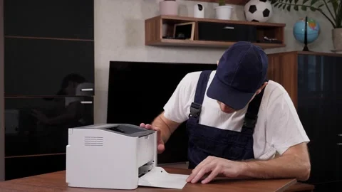 Repairman with screwdriver fixing modern printer in office. Stock Footage 200801761