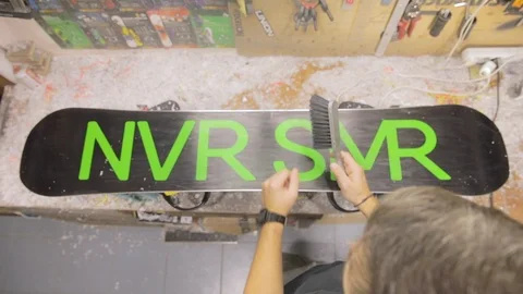 Repairman Is Sweep Or Brush Off Dust. Snowboard Maintenance And Repair Concept. 스톡 동영상 125856653