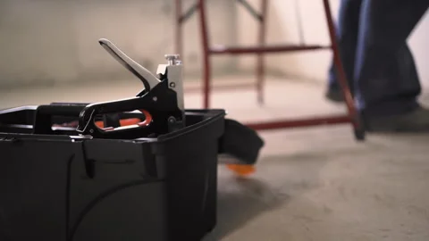 Repairman taking a stapler from the toolbox Stock Footage 311703757
