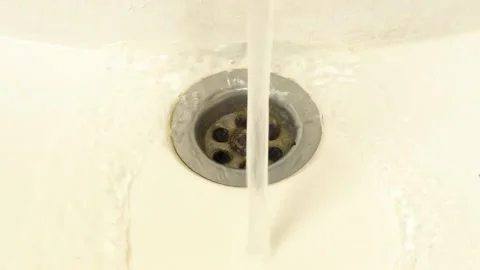 The repairman updates the keyboard keys, washes it under running water. Plast Stock Footage 150922183