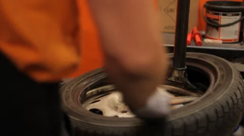 Reparation of a wheel in a garage Stock Footage 61013022