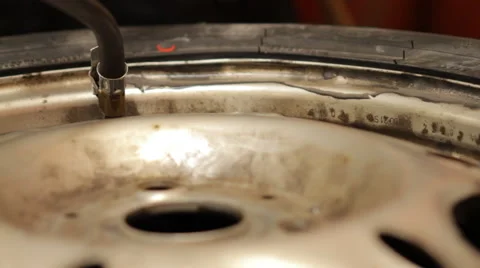 Reparation of a wheel in a garage Stock Footage 61013308