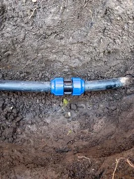 Reparing water pipe with compression fitting Stock Photos