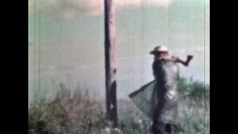 Repeat offender man sabotaging telegraph wires in countryside. Sabotage Video stock 281240981