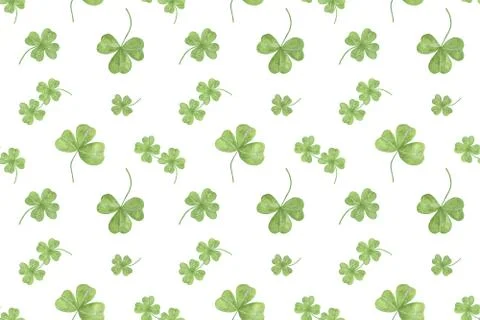 A repeat pattern of hand drawn watercolor green shamrock leaves イラスト素材