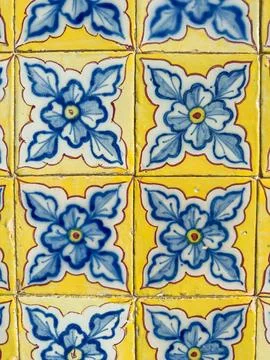 A repeat pattern of vintage ceramic tiles showcasing classic blue floral mo.. Stock Photos