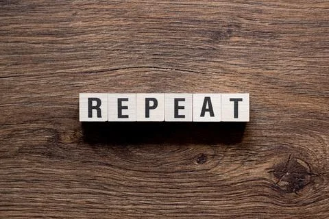 Repeat - word concept on building blocks, text Stock Photos