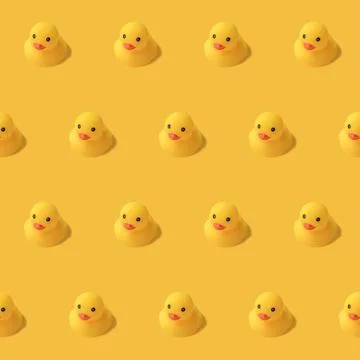 Repeatable pattern of yellow rubber duck on yellow background Modern style. c Stock Photos