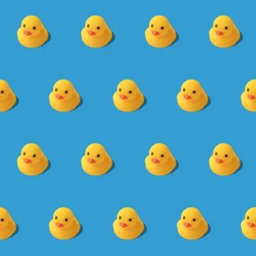 Repeatable pattern of yellow rubber duck on blue background Modern style. cre Stock Photos