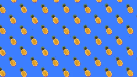 A repeated pattern of yellow ananas fruits, floating towards the upper Stock Footage 117253368