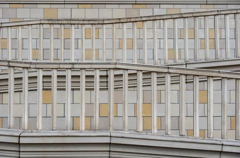 Repeating geometric pattern with railings on modern building facade design Stock Photos