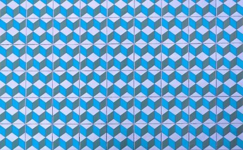Repeating geometric patterns of ceramic floor cubes on the floor. Stock Photos