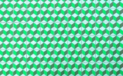 Repeating geometric patterns of cubes on the floor of ceramic tile. Stock Photos