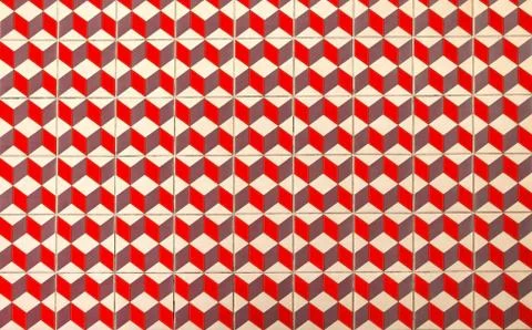 Repeating geometric patterns of cubes on the floor of ceramic tile. Stock Photos