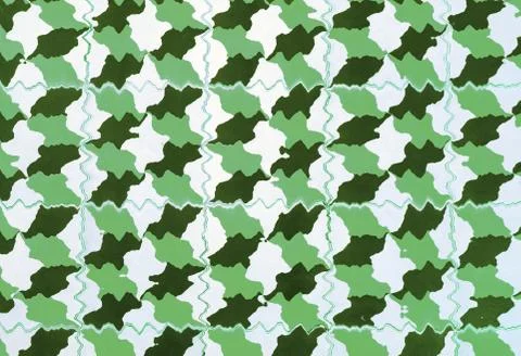 Repeating geometric patterns of dice on the floor of ceramic tile. Stock Photos