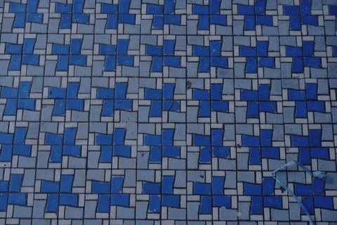 A repeating pattern of blue and gray square tiles Stock Photos