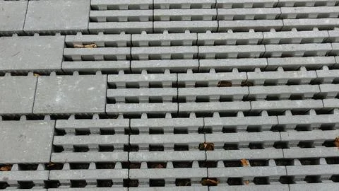 Repeating Pattern of Grey Concrete Interlocking Blocks Stock Photos