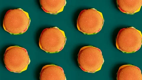Repeating Pattern of Hamburgers Top View on Teal Studio Background Stock Footage 133482636