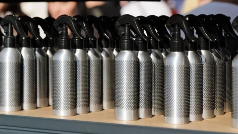 Repeating pattern of metallic spray atomizers, ready for branding and Stock Footage 344698026