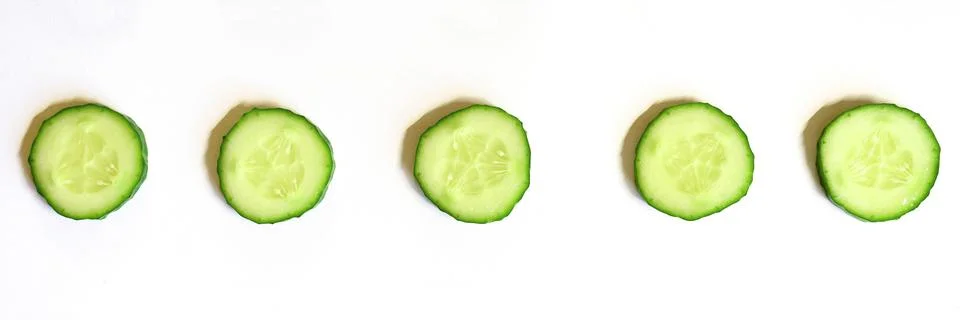 Repeating pattern of sliced semicircles of fresh raw vegetable cucumbers for  Stock Photos