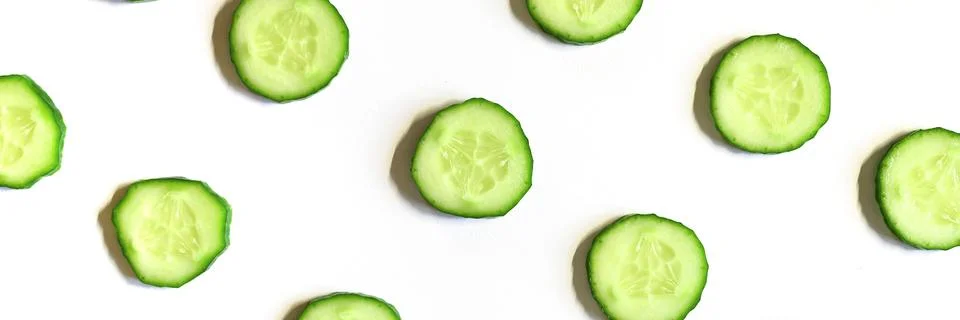 Repeating pattern of sliced semicircles of fresh raw vegetable cucumbers for  Stock Photos