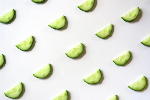 Repeating pattern of sliced semicircles of fresh raw vegetable cucumbers for  Stock Photos