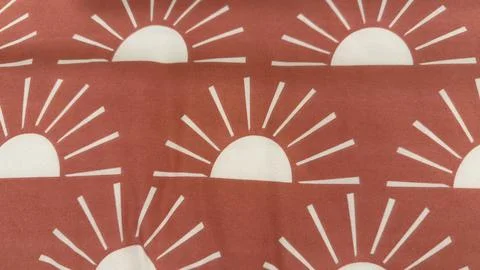 Repeating Pattern of Sunbursts on a Terracotta Background - Artistic and De.. Stock Photos