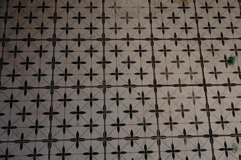A repeating pattern of vintage square floor tiles Fotos Stock