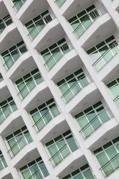 Repeating pattern of windows and balcony. Bulding front Stock Photos