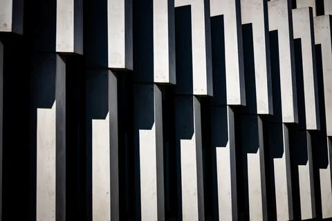 Repeating pattern of windows of a building. Optical effect by the shade of th Stock Photos