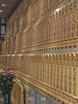 Repeating Rows of Golden Ancestral Tablets in Chinese Temple Фото