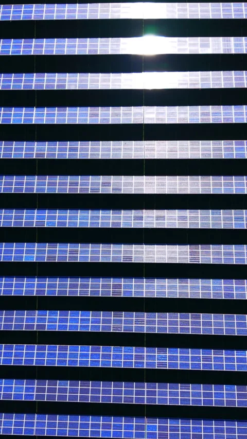 Repeating rows of solar modules seen from above Vertical video. Video stock 338008110