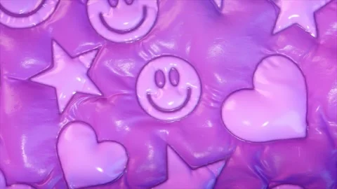 Repeating smiley faces, stars, and hearts with a glossy finish on a purple Stock Footage 277529408