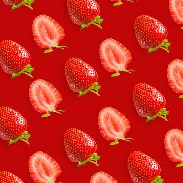 Repeating strawberry pattern on a red background Stock Photos