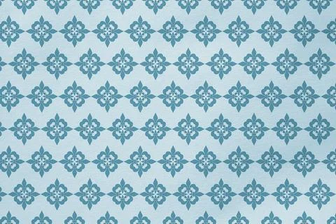 Repeating teal floral geometric pattern is covering pale blue surface, showing Foto stock