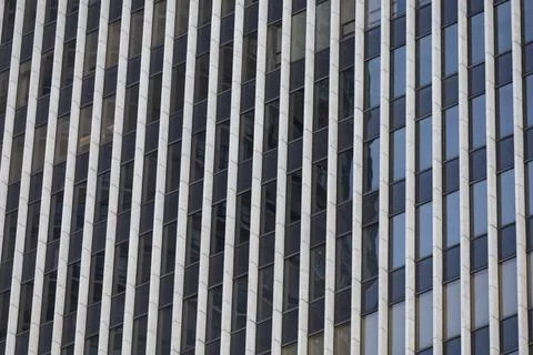 Repeating Vertical Windows on Modern Building Facade Stock Photos